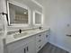 Modern bathroom with dual sinks, vanity and sleek black fixtures at 5000 Windsor Green Way # 204, Myrtle Beach, SC 29579