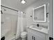 A full bathroom featuring a shower/tub combo, white cabinets, and a lighted mirror at 5000 Windsor Green Way # 204, Myrtle Beach, SC 29579