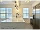 Contemporary kitchen featuring quartz counters, stainless steel appliances, and ample natural light at 5000 Windsor Green Way # 204, Myrtle Beach, SC 29579