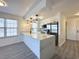 Bright, renovated kitchen featuring new quartz countertops and stainless steel appliances at 5000 Windsor Green Way # 204, Myrtle Beach, SC 29579