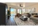 Living room featuring sliding doors to balconies, decor, and gray wood-look flooring at 5000 Windsor Green Way # 204, Myrtle Beach, SC 29579