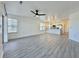 Living room with gray wood-look flooring and open floorplan to kitchen space at 5000 Windsor Green Way # 204, Myrtle Beach, SC 29579