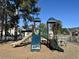 Community playground with slides, climbing wall, and play features on a woodchip surface at 5000 Windsor Green Way # 204, Myrtle Beach, SC 29579