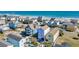 Aerial view of colorful homes near the ocean, some with private pools and ample parking at 512B S Ocean Blvd., Surfside Beach, SC 29575