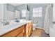 Bright bathroom with a double sink vanity, tile floors and shower/tub combination at 512B S Ocean Blvd., Surfside Beach, SC 29575