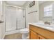 Bright bathroom featuring a glass enclosed shower, modern vanity, and tile flooring at 512B S Ocean Blvd., Surfside Beach, SC 29575