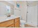 Clean bathroom featuring a walk-in shower, modern vanity, and neutral decor at 512B S Ocean Blvd., Surfside Beach, SC 29575