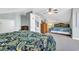 Bedroom features two beds, ceiling fan, dresser with TV, and access to the stairway at 512B S Ocean Blvd., Surfside Beach, SC 29575