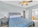 Spacious bedroom featuring a queen bed, soft carpet, and stylish lamps on the nightstands at 512B S Ocean Blvd., Surfside Beach, SC 29575