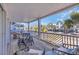 Wide porch showcasing outdoor seating area with views of the neighborhood at 512B S Ocean Blvd., Surfside Beach, SC 29575