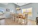 Bright dining area features tile flooring, large table with seating for ten, and stylish decor at 512B S Ocean Blvd., Surfside Beach, SC 29575