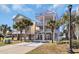Bright beach house featuring multiple levels, decks, palm trees, and convenient ground-level parking at 512B S Ocean Blvd., Surfside Beach, SC 29575