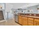 Open kitchen featuring stainless steel appliances, granite countertops, and natural wood cabinetry at 512B S Ocean Blvd., Surfside Beach, SC 29575