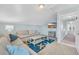 Upstairs living room with vaulted ceiling, TV, comfortable seating and view of the landing at 512B S Ocean Blvd., Surfside Beach, SC 29575