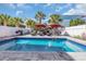 Backyard oasis featuring a private pool, lounge chairs, and mature landscaping at 512B S Ocean Blvd., Surfside Beach, SC 29575