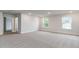 Bonus room features two windows, neutral paint, and carpet at 515 Haven View Way, Murrells Inlet, SC 29576