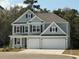 Charming two-story home featuring a two-car garage, beautiful architectural details, and professional landscaping at 515 Haven View Way, Murrells Inlet, SC 29576