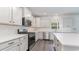 Well-equipped kitchen with stainless steel appliances, white cabinets, and a center island with seating at 515 Haven View Way, Murrells Inlet, SC 29576