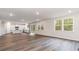 Open-concept living space boasts hard surface floors, recessed lighting, and large windows at 515 Haven View Way, Murrells Inlet, SC 29576
