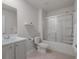 Bathroom featuring a white vanity, toilet, and tiled shower at 55 Porch Ln., Pawleys Island, SC 29585
