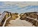 Scenic view of a beach path leading to the sandy shores at 55 Porch Ln., Pawleys Island, SC 29585