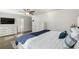 Bright bedroom featuring a large bed, white furniture and a ceiling fan at 55 Porch Ln., Pawleys Island, SC 29585