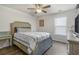 Bedroom featuring a bed with a blue and white striped blanket and side table at 55 Porch Ln., Pawleys Island, SC 29585