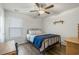 Bedroom featuring a bed with blue blanket and wooden floors at 55 Porch Ln., Pawleys Island, SC 29585