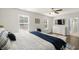 Bright bedroom featuring a ceiling fan, television, and an ensuite bathroom at 55 Porch Ln., Pawleys Island, SC 29585