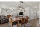 Inviting dining area with wood floors, modern lighting, and a spacious layout with easy access to living room and kitchen at 55 Porch Ln., Pawleys Island, SC 29585