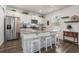 Contemporary kitchen featuring granite countertops, white cabinets, stainless steel appliances, and a convenient island with seating at 55 Porch Ln., Pawleys Island, SC 29585