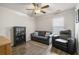 Cozy living room with hardwood floors, a comfy sofa, chair, and shelving unit at 55 Porch Ln., Pawleys Island, SC 29585