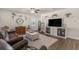 Inviting living room features wood floors, a ceiling fan, and ample natural light at 55 Porch Ln., Pawleys Island, SC 29585