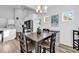 Charming dining area adjacent to kitchen featuring a modern chandelier at 563 Rycola Circle, Surfside Beach, SC 29575