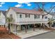 Beautiful home with a metal roof, elevated design, outdoor parking, and surrounded by lush landscaping at 6001 - 8008 S Kings Hwy., Myrtle Beach, SC 29575