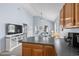 Open kitchen with breakfast bar and a view into the open concept living area at 6001 - 8008 S Kings Hwy., Myrtle Beach, SC 29575