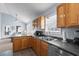 Kitchen featuring wooden cabinets, stainless steel appliances, with a view to the living area at 6001 - 8008 S Kings Hwy., Myrtle Beach, SC 29575