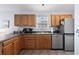 Well-equipped kitchen with updated stainless steel appliances, and solid surface countertops at 6001 - 8008 S Kings Hwy., Myrtle Beach, SC 29575