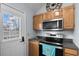 Well-equipped kitchen featuring stainless steel appliances and an adjacent door to the exterior at 6001 - 8008 S Kings Hwy., Myrtle Beach, SC 29575