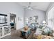 Comfortable living room features cozy seating, bright windows, with open access to bedroom at 6001 - 8008 S Kings Hwy., Myrtle Beach, SC 29575
