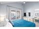 Bright main bedroom features a ceiling fan and a big window with blinds at 6001 - 8008 S Kings Hwy., Myrtle Beach, SC 29575