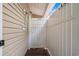Outdoor shower featuring wood plank floor, vinyl siding and white vinyl partition at 6001 - 8008 S Kings Hwy., Myrtle Beach, SC 29575
