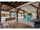 Spacious outdoor area under the home, featuring seating, a swing, outdoor TV, and covered space at 6001 - 8008 S Kings Hwy., Myrtle Beach, SC 29575