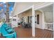 Inviting covered porch with comfortable seating and an outdoor dining set, perfect for relaxation and enjoyment at 6001 - 8008 S Kings Hwy., Myrtle Beach, SC 29575