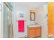 Clean bathroom featuring a sink, vanity, shower, and ample lighting at 6001-Mh206 S Kings Hwy., Myrtle Beach, SC 29575