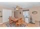 Bright dining room with a ceiling fan, a wooden table and chair set, and natural light at 6001-Mh206 S Kings Hwy., Myrtle Beach, SC 29575
