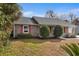 Well-kept brick home with red shutters and verdant landscaping at 614 Cavandish Dr., Myrtle Beach, SC 29588