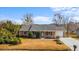 Charming single-story home featuring a manicured lawn and cozy front porch at 614 Cavandish Dr., Myrtle Beach, SC 29588