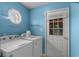 Functional laundry room features modern washer, dryer, and access to the exterior at 614 Cavandish Dr., Myrtle Beach, SC 29588