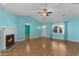 Spacious living room with a fireplace and natural light from large windows at 614 Cavandish Dr., Myrtle Beach, SC 29588